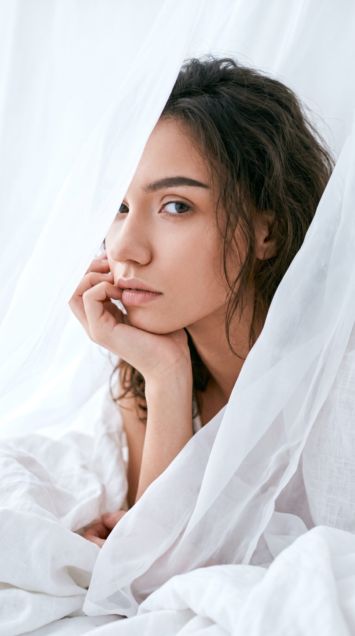 Woman with glowing natural skin - Pretty Edit Studio skincare blog