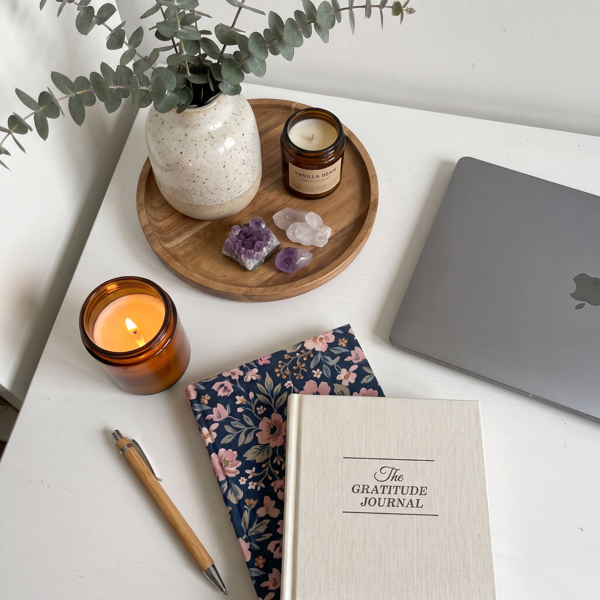 Gratitude journal with pen and flowers