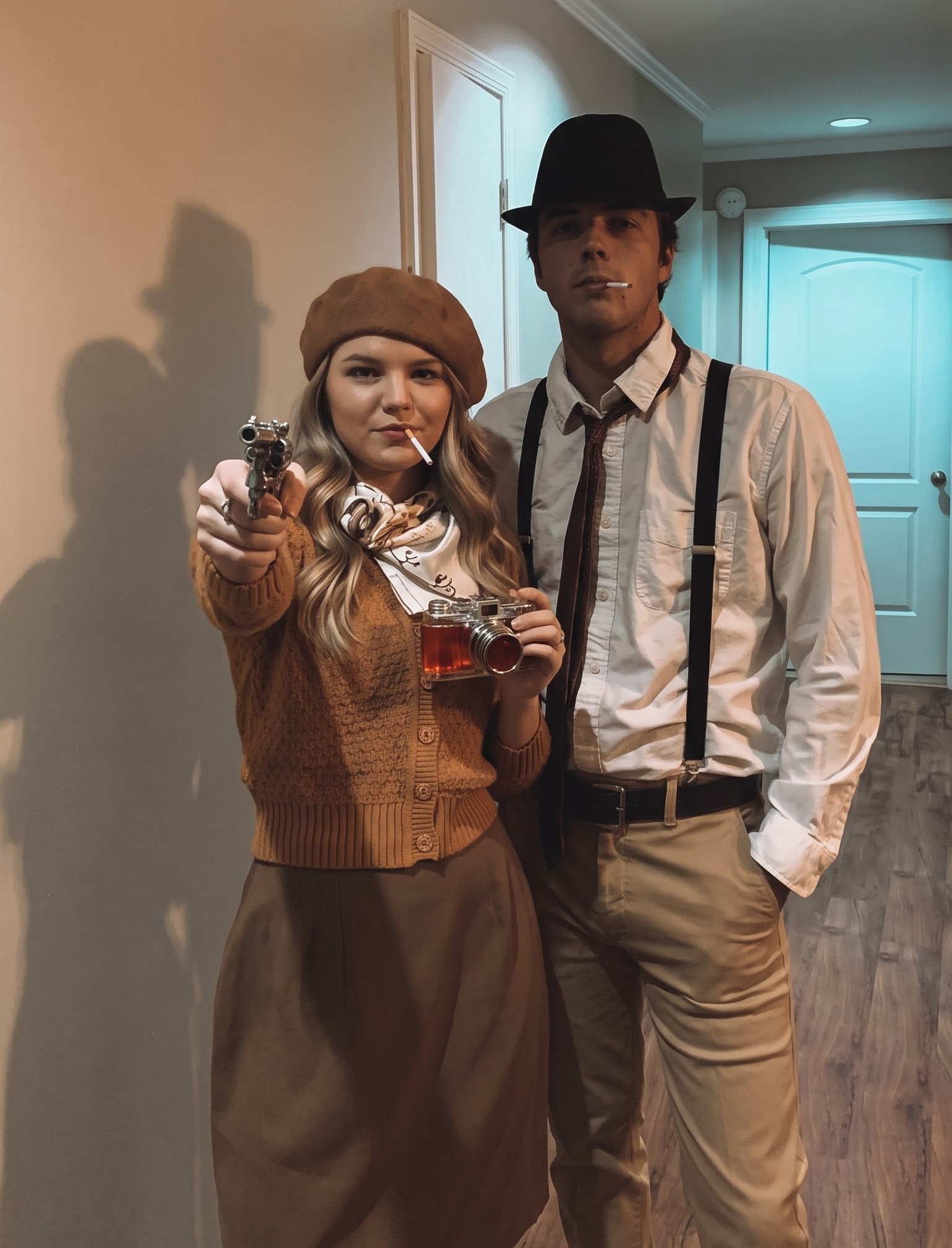 Bonnie and Clyde duo Halloween costume with a beret fedora and suspenders