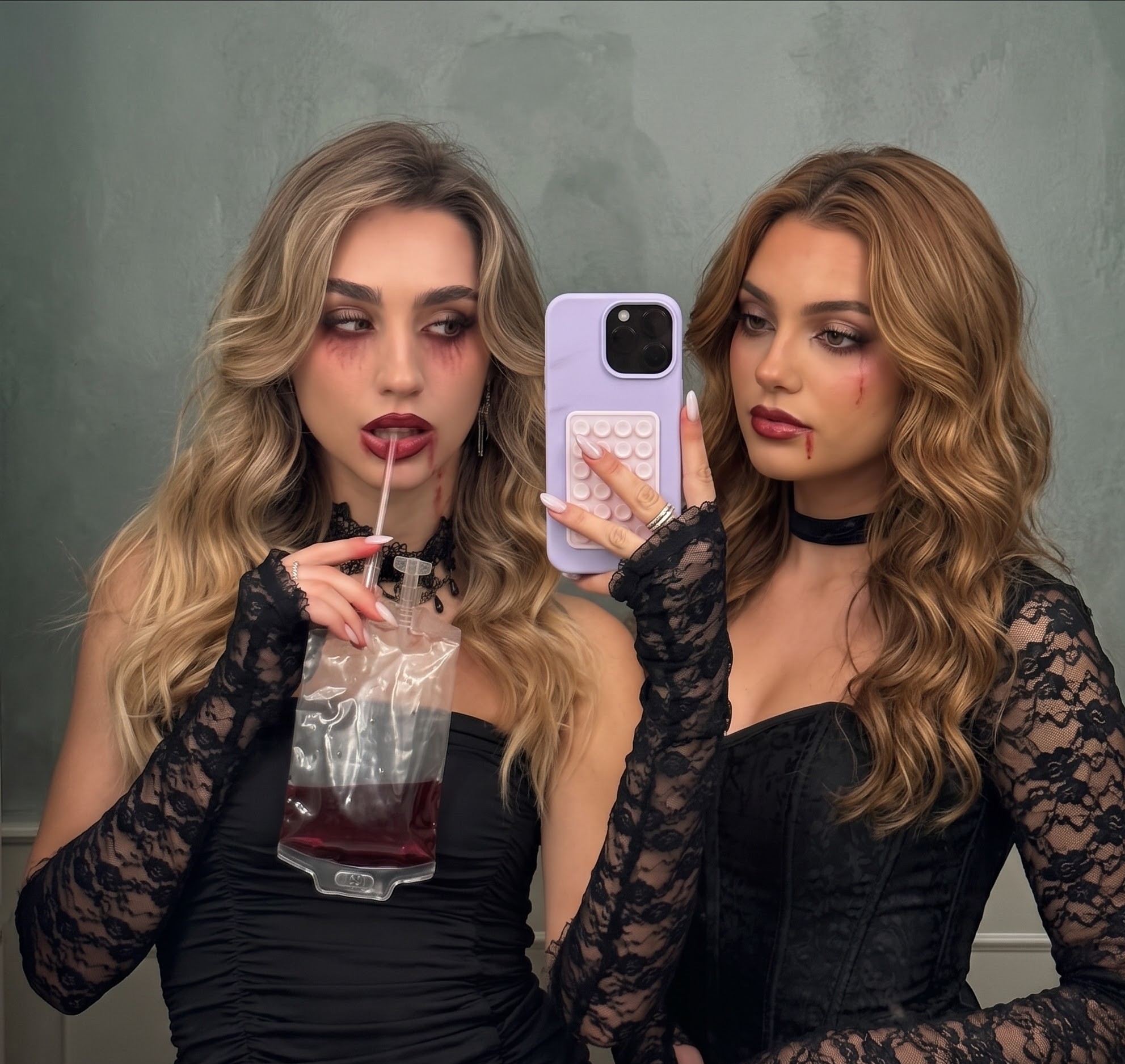 Vampire duo Halloween costume in black corsets with dark vampire makeup