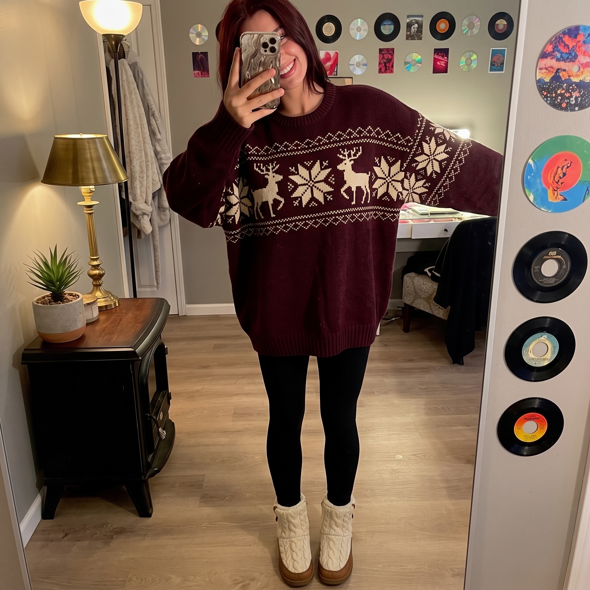Oversized burgundy reindeer Fair Isle Christmas sweater with black leggings and cable knit boots