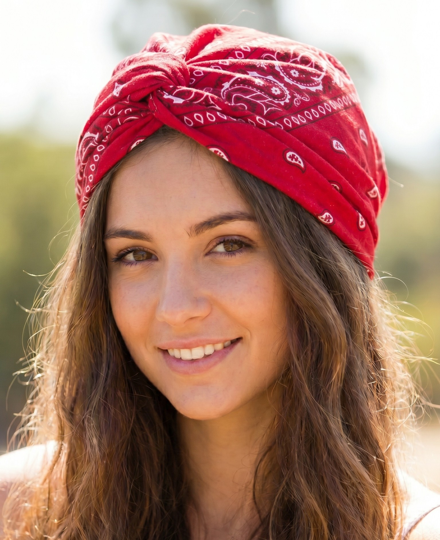 Messy top knot bun wrapped with a bandana