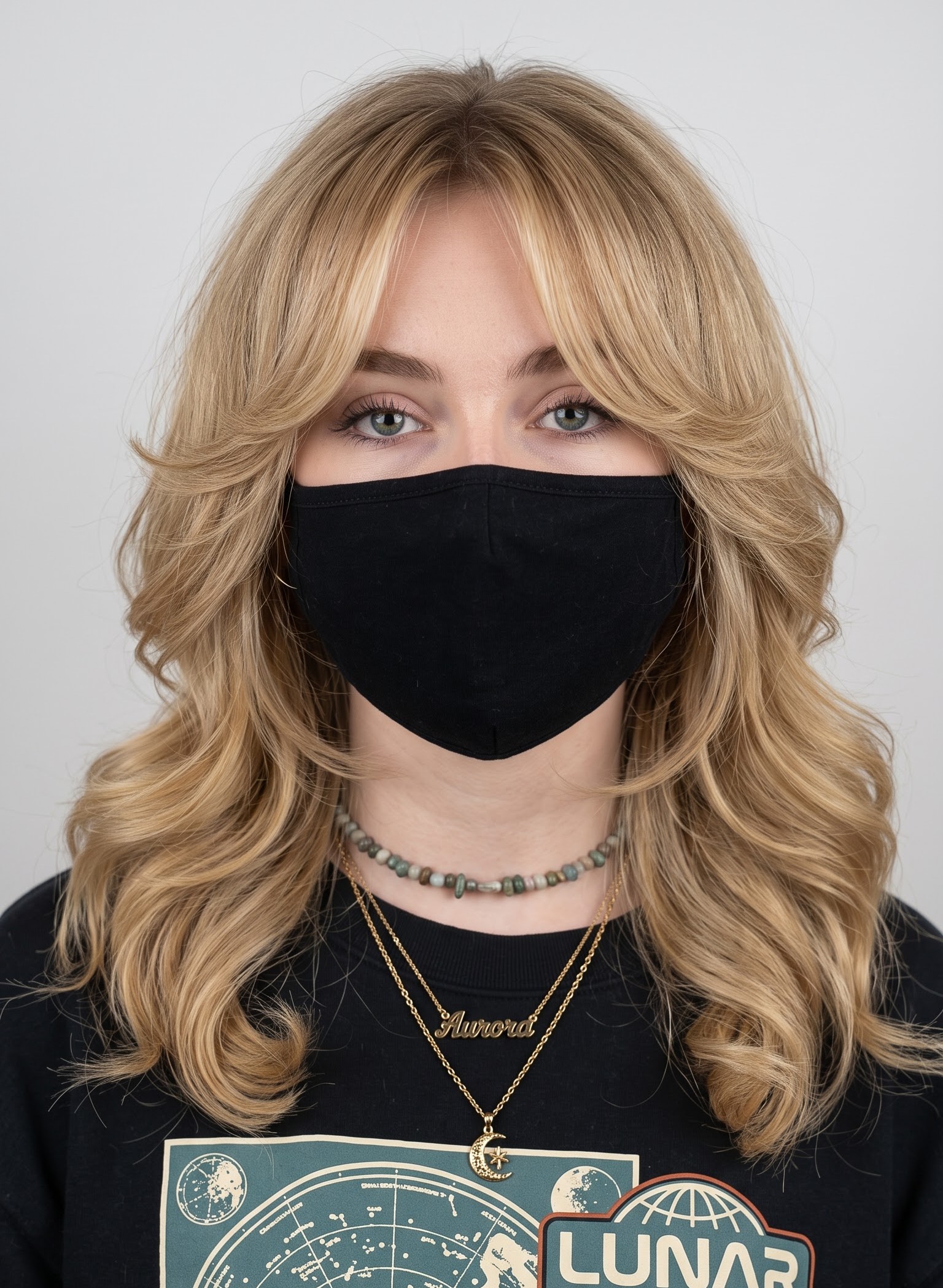 Blonde wolf cut with curtain bangs and soft brushed-out waves