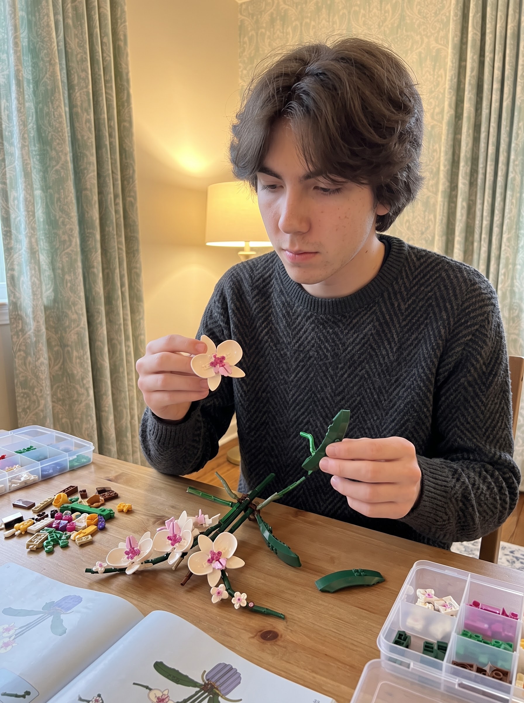 Person carefully assembling a detailed flower building set at a table