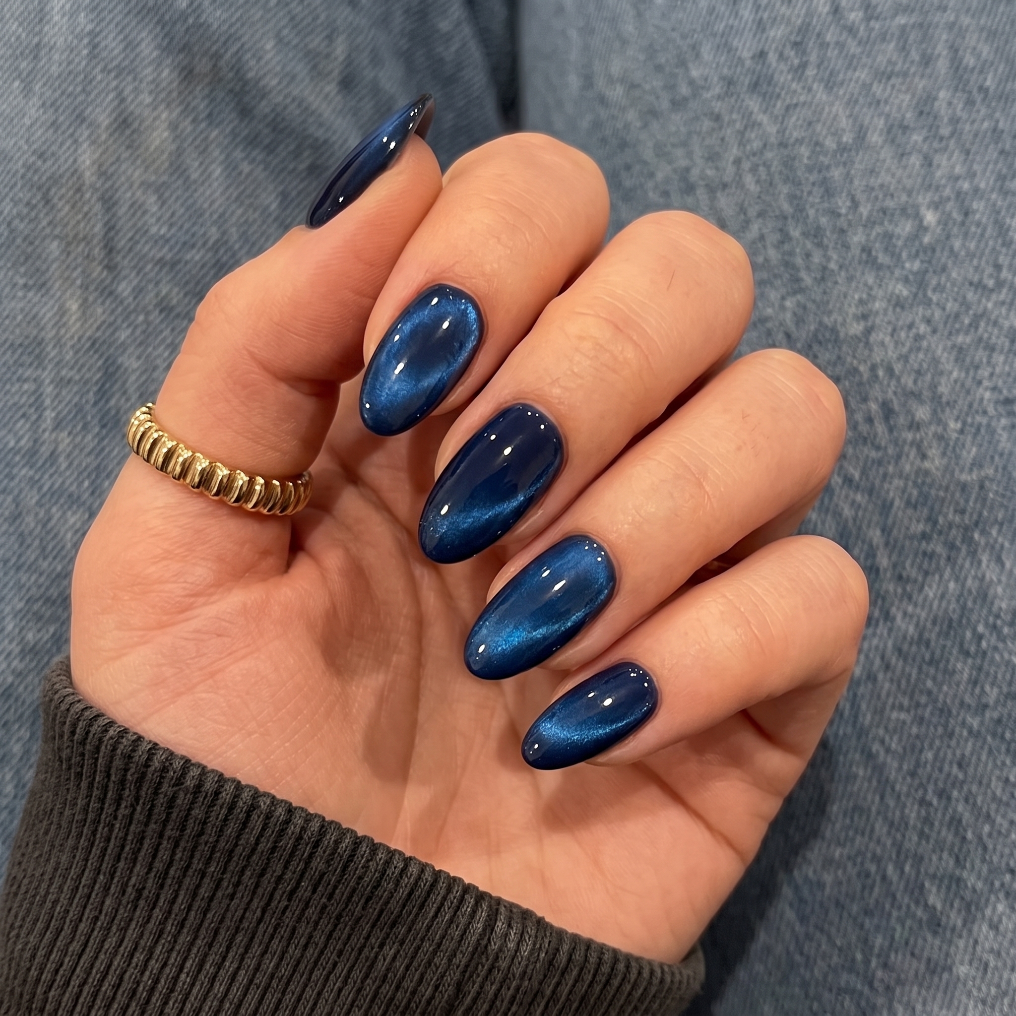 Midnight navy blue cat eye nails with subtle shimmer
