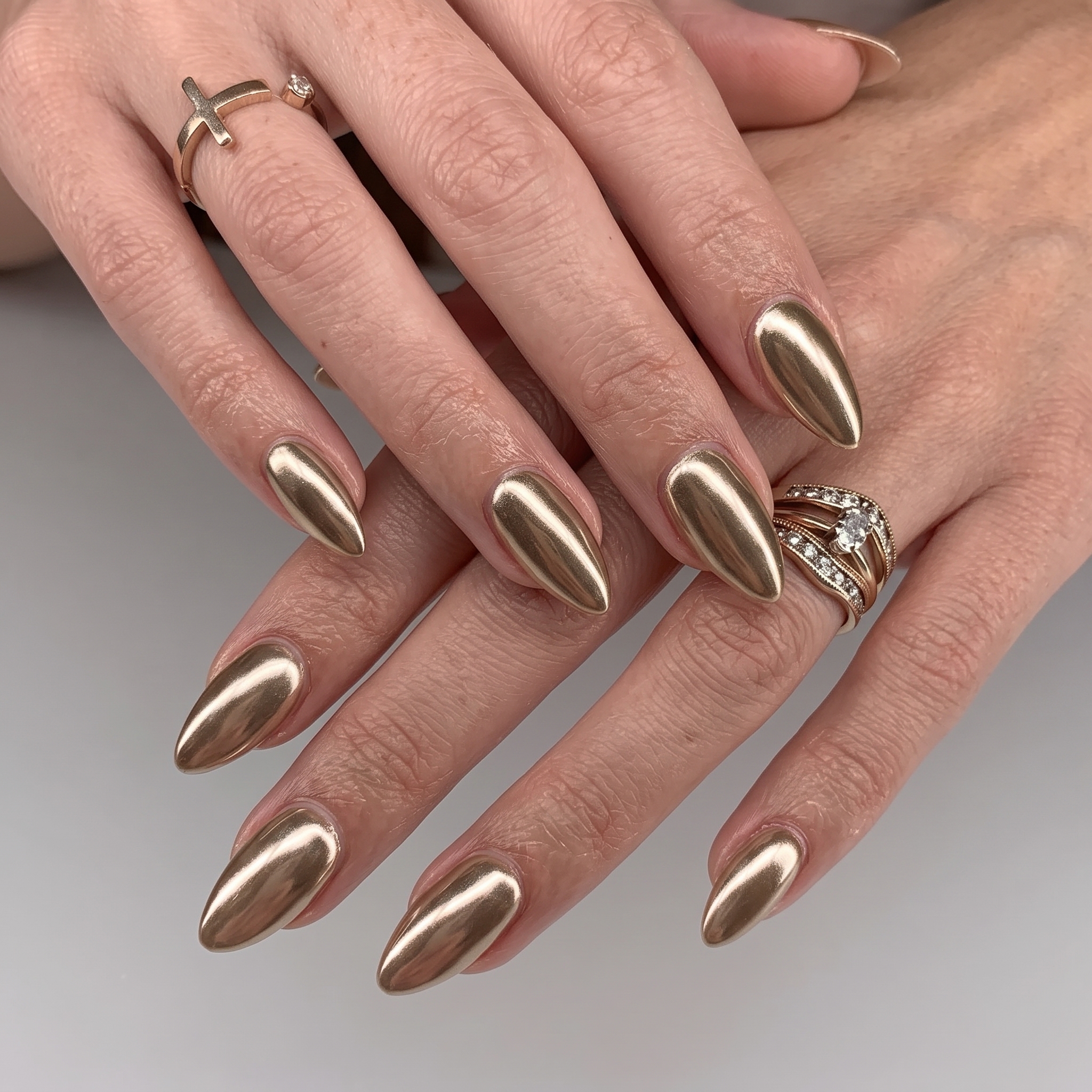 Rose gold chrome graduation nails