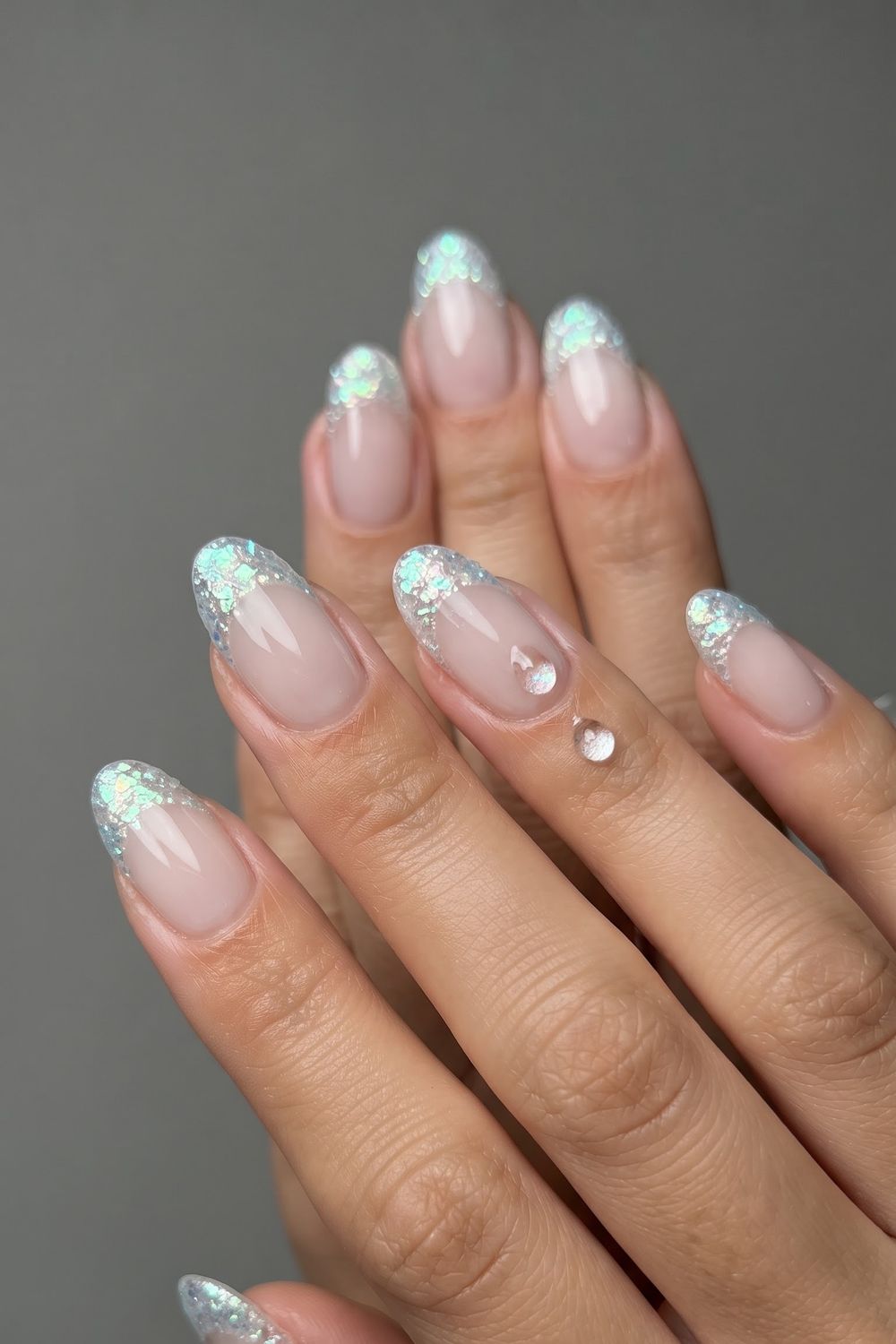 Multicolor jewel tone fall nails styled with a signet ring