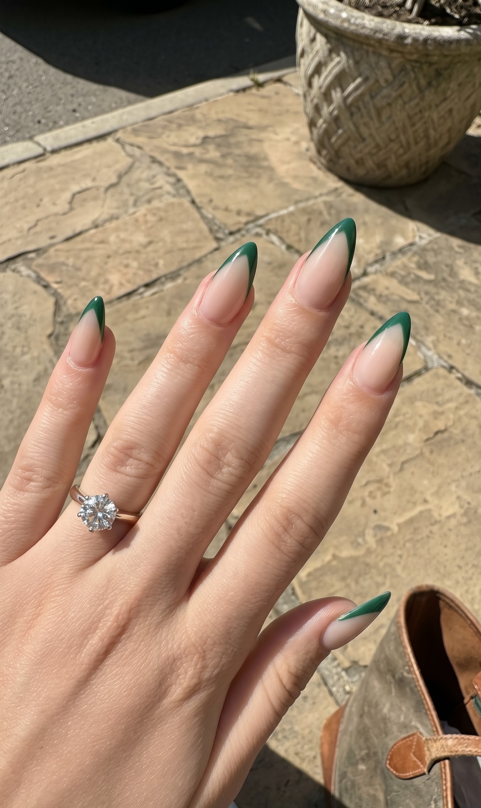 Nude almond nails with a soft green ombre french tip