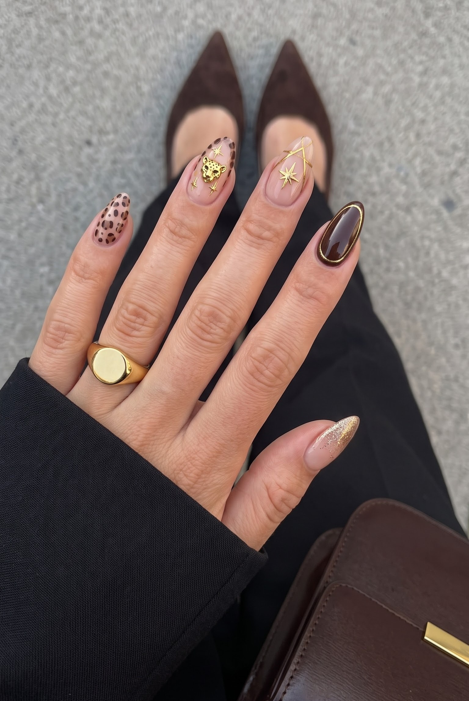 Nude nails with leopard print accent, gold leopard charm and star charm french tips