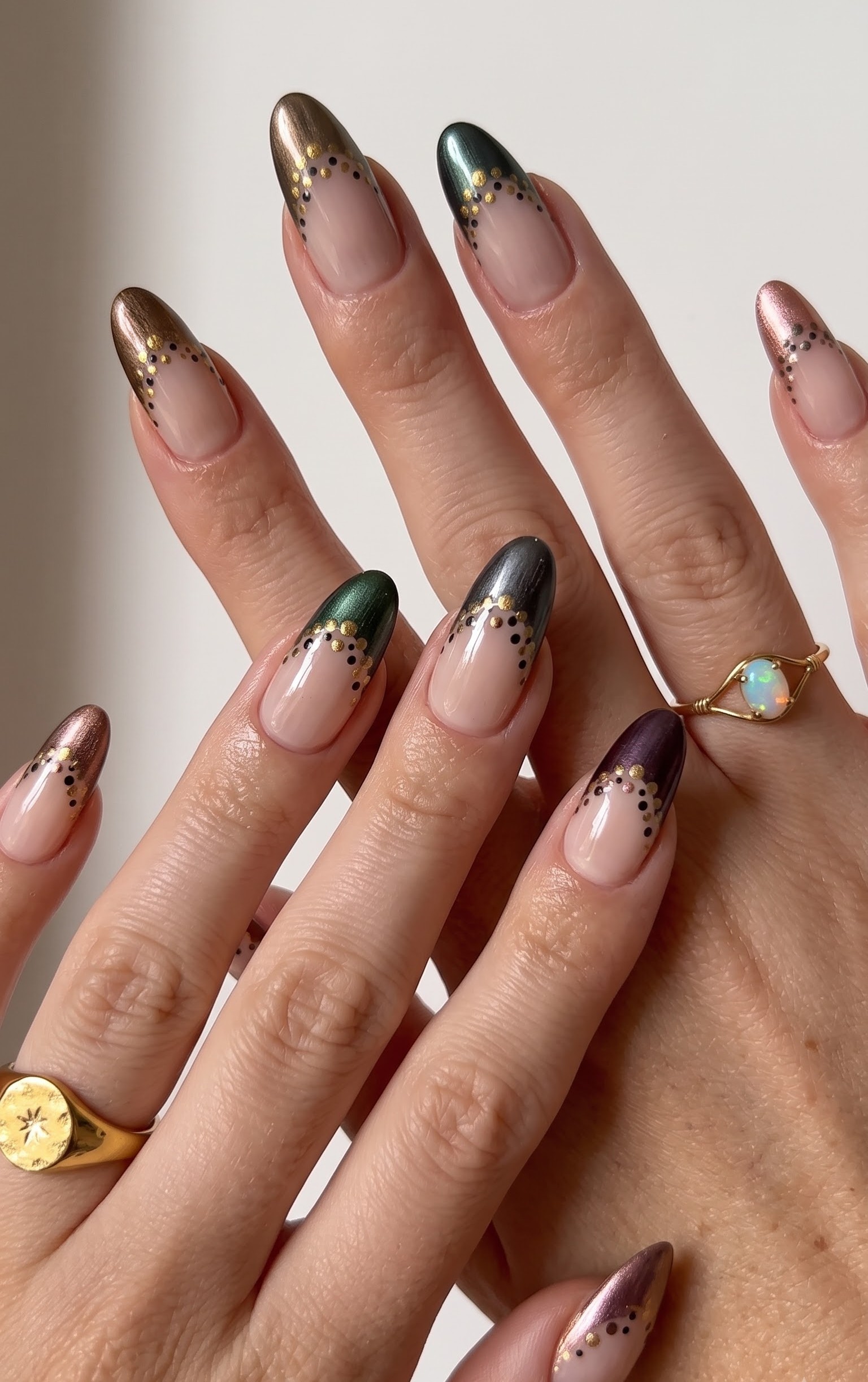 Metallic gold, green, bronze and purple french tips with a gold and black dot border
