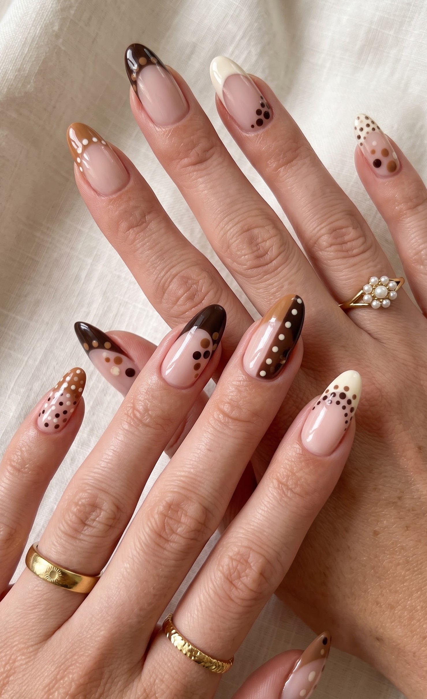 Brown, cream and caramel almond nails with mixed size polka dot french tips