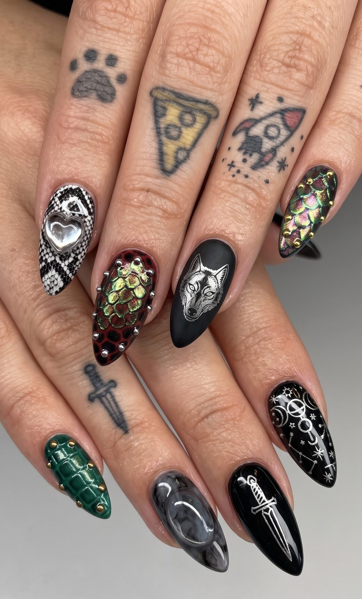 Gothic nail set with snakeskin, dragon scale texture with studs, a matte wolf portrait and celestial art
