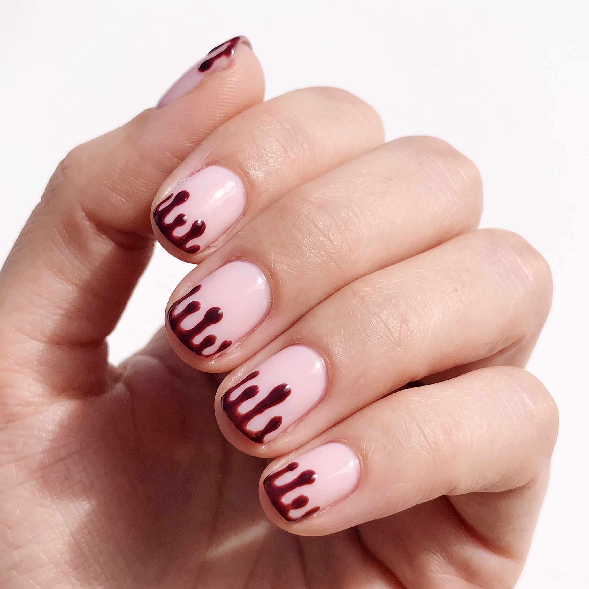 Matte black stiletto Halloween nails carved into a 3D moth wing texture