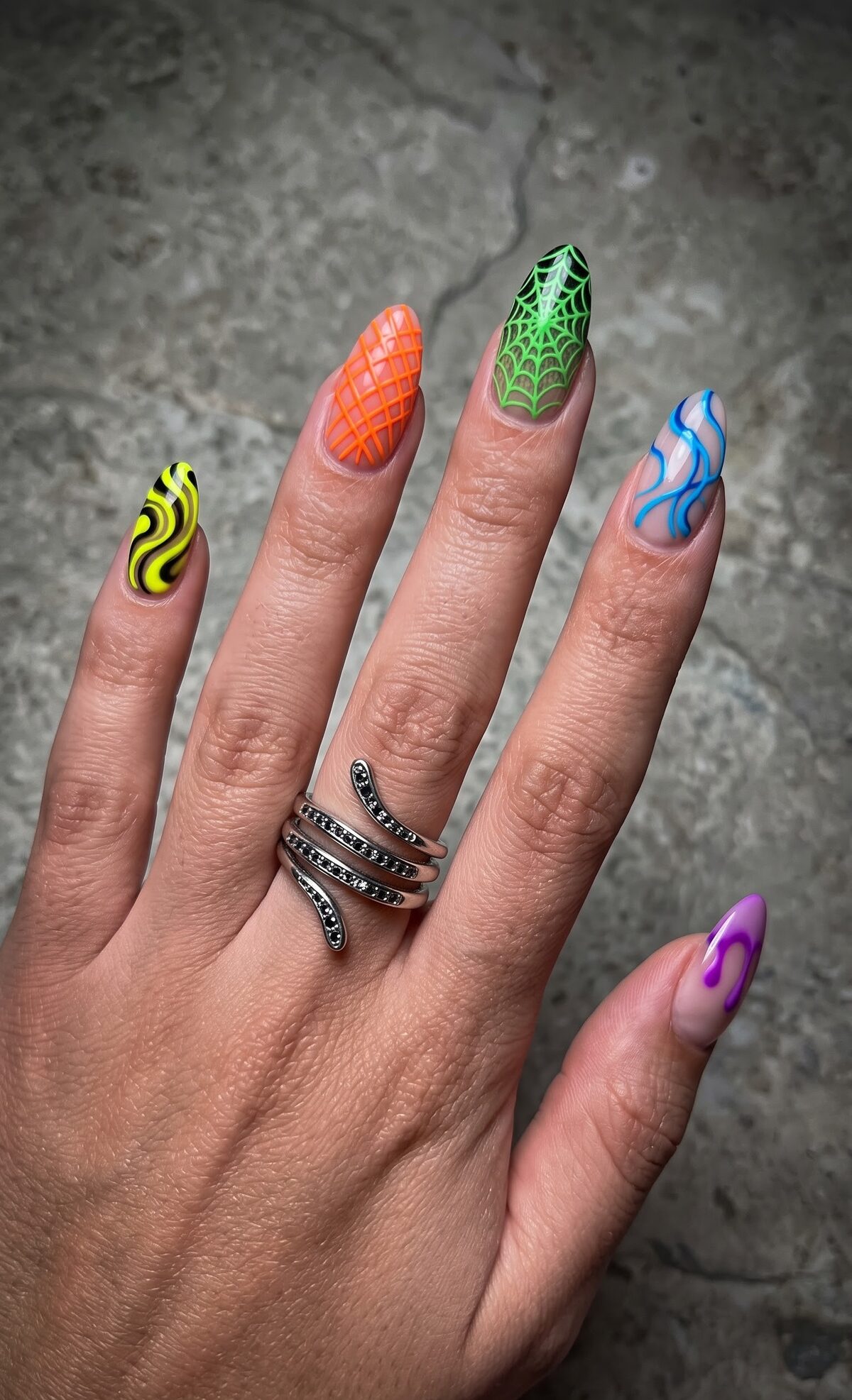 Neon yellow swirl, orange lattice, green spiderweb, blue flame and purple drip nail art