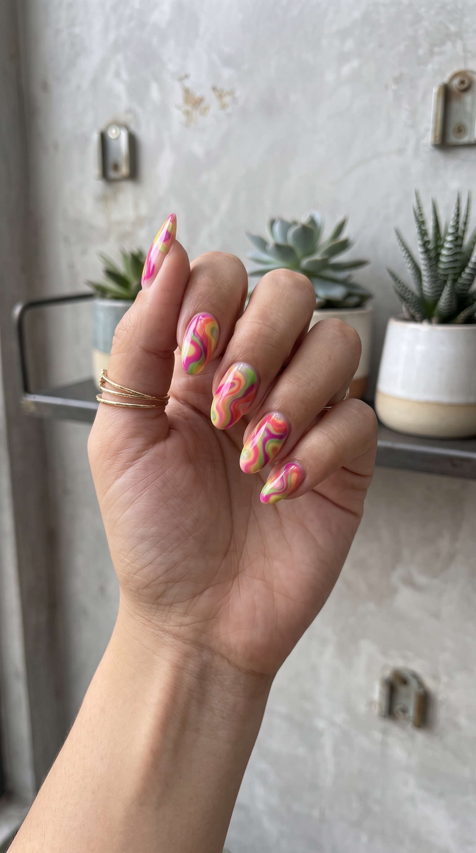 Neon swirl summer nails in hot pink lime green orange yellow psychedelic pattern