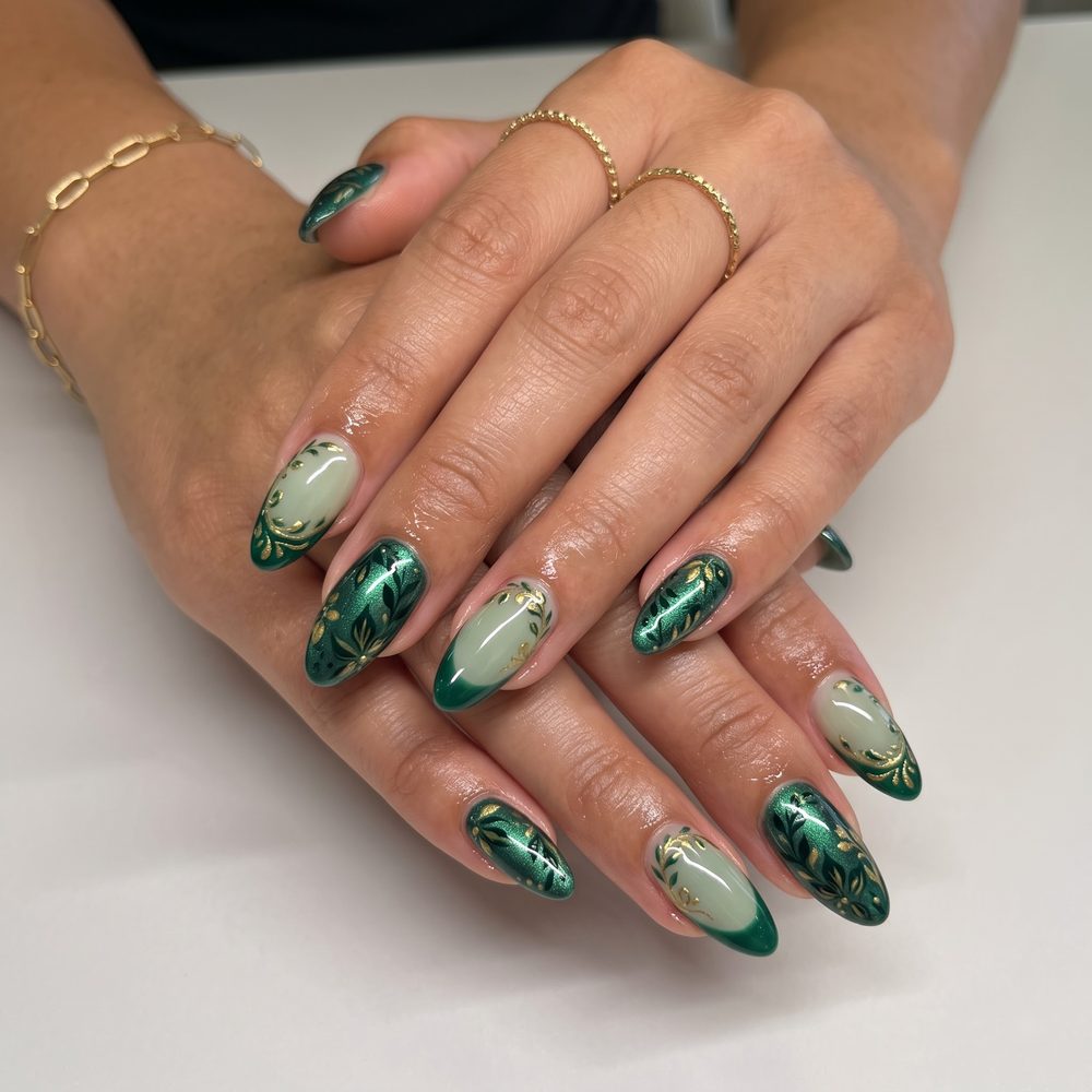 Emerald chrome and sage green almond nails with hand-painted gold botanical leaves