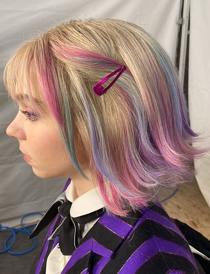 Blonde bob with pastel pink, blue and purple peekaboo streaks underneath