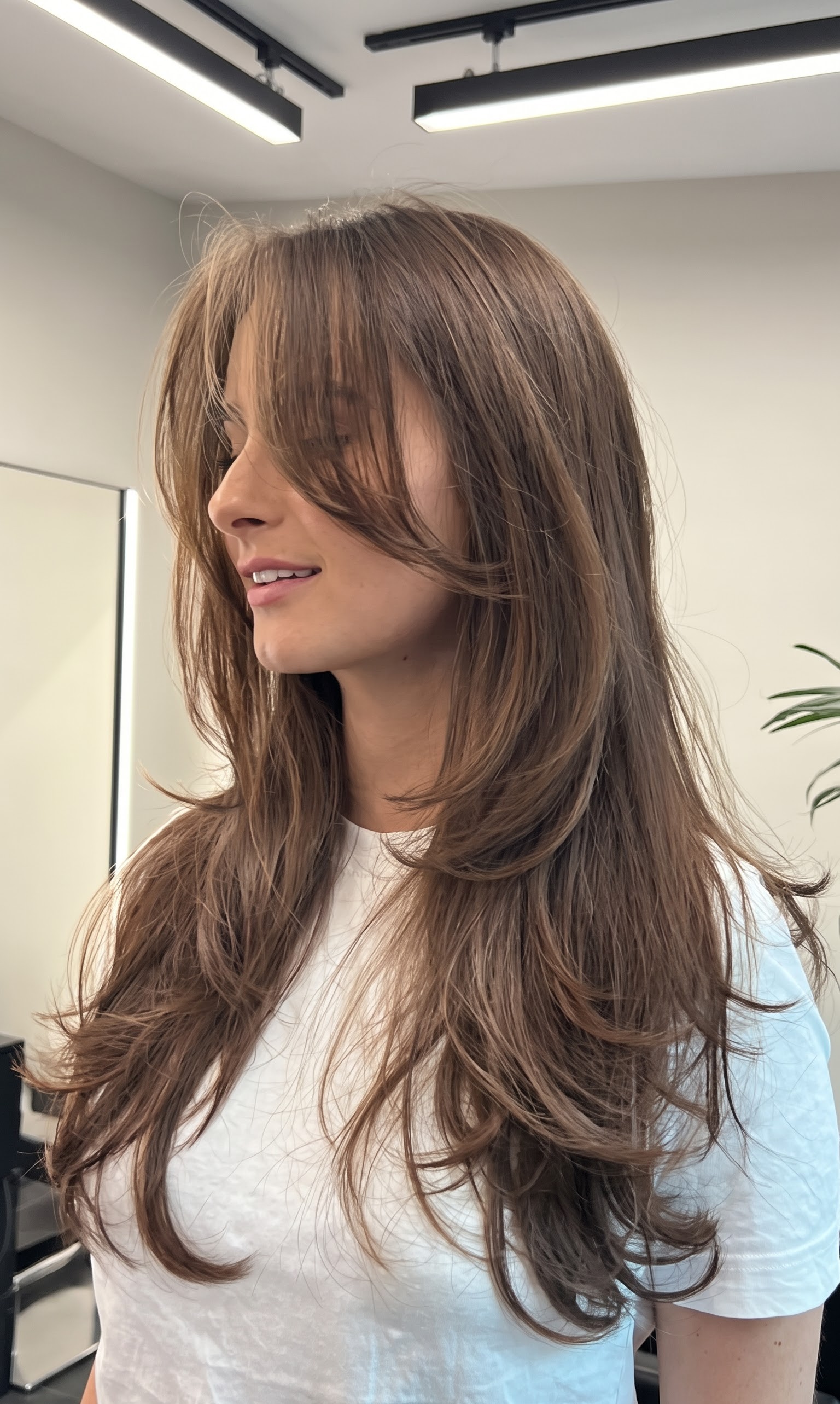 straight curtain bangs with piece-y texture and green eyes